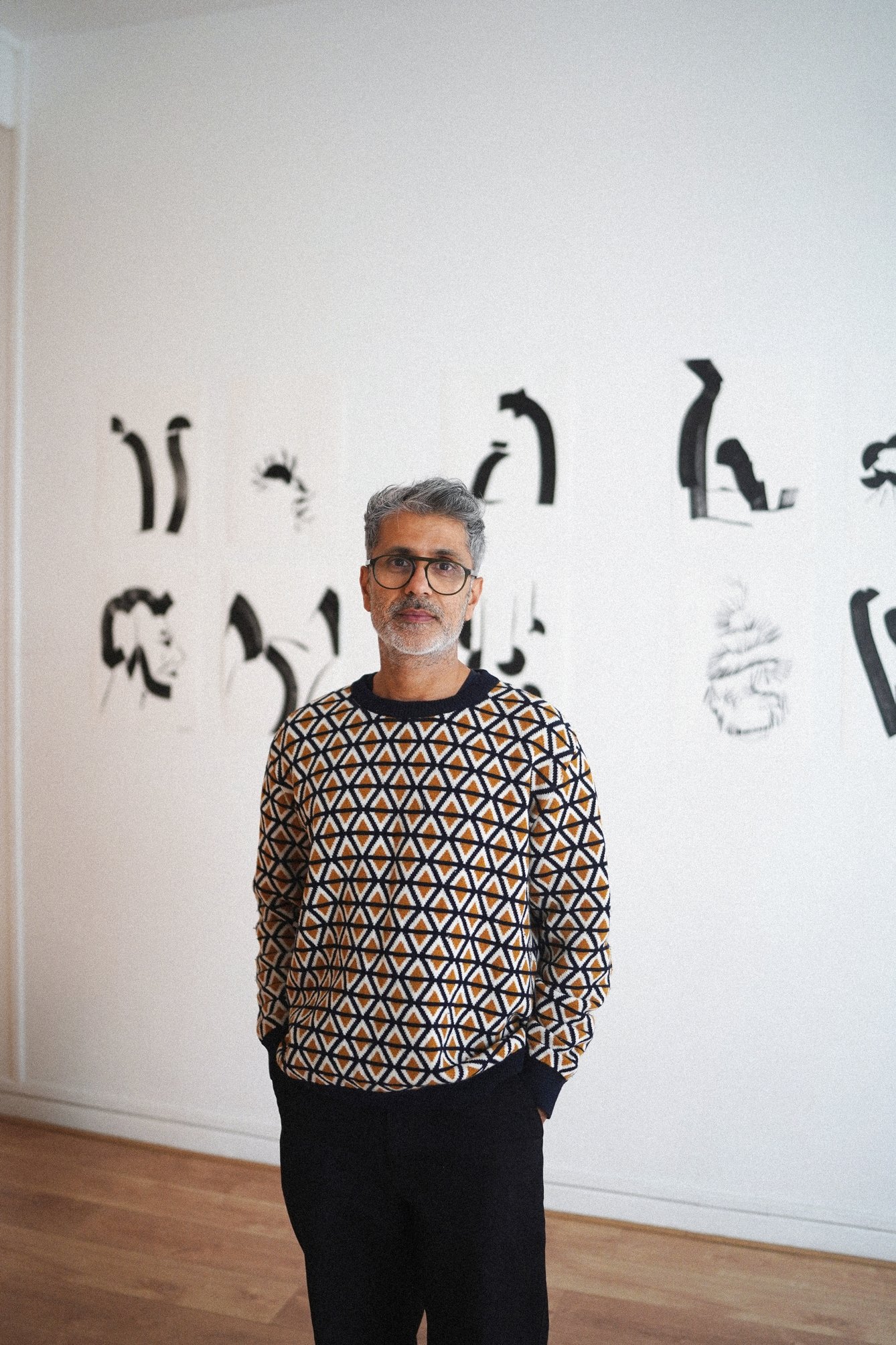 Mohammed Ismail alone at his gallery wall